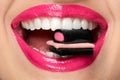 Pink Lips. Woman With Candy In Mouth.