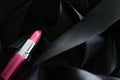 Pink lipstick on black silk background, luxury make-up and beauty cosmetic Royalty Free Stock Photo