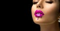 Pink Lipstick dripping. Paint drops on red lips, lipgloss dripping from sexy lips, Purple liquid drops on beautiful model girl`s m Royalty Free Stock Photo