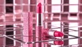 Pink lipstick on a shiny surface. Royalty Free Stock Photo