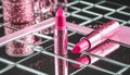 Pink lipstick on a shiny surface. Royalty Free Stock Photo