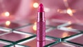 Pink lipstick on a shiny surface. Royalty Free Stock Photo