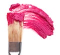 Pink lipstick stroke (sample) with makeup brush Royalty Free Stock Photo