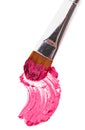 Pink lipstick stroke (sample) with makeup brush Royalty Free Stock Photo