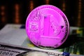 Pink Litecoin LTC coin is surrounded by a money background Royalty Free Stock Photo