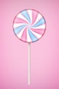 Pink Lolipop candy on pastel pink background.