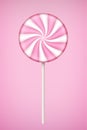 Pink Lolipop candy on pastel pink background.