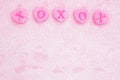 Pink love background with pink fabric and candy hearts background