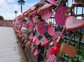 Pink love locks on a fence on Penang Hill