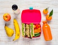 Pink Lunch Box with Tasty looking Fruits and Vegetables