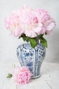 pink luxurious peonies in an ancient Chinese vase with blue ornament, springtime Royalty Free Stock Photo