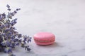 Pink macaron and bunch lavender on white natural marble table