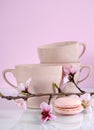 Pink macaron cookie with vintage cups