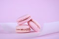 Pink macarons petit fours cookies close up