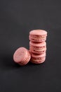 Pink macarons stacked in a pile