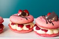 Pink macarons stuffed with cream and strawberries. pastel colors Royalty Free Stock Photo