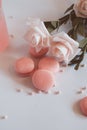 Pink macaroons with bouquet of rose on marble table, pastel colored, Royalty Free Stock Photo