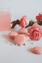 Pink macaroons with bouquet of rose on marble table, pastel colored, Royalty Free Stock Photo