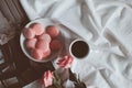 Pink macaroons with coffee cup and pink rose in vintage tone. Royalty Free Stock Photo