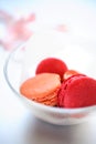 Pink macaroons in glass bowl