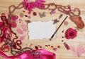 Pink and Magenta Jewelry With Flower and Blank Paper With Burned Edges Royalty Free Stock Photo