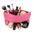 Makeup brushes and cosmetics in pink pouch isolated on white background Royalty Free Stock Photo