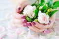 Pink manicure and roses