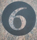 Black marble circle and number 6