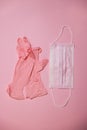 pink mask and gloves on a pink background Royalty Free Stock Photo