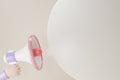 Pink megaphone loudspeaker with chat bubble isolate on beige background. Magaphone with copy space for texts or message. 3d