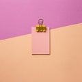 Pink memo paper, sticky notes with yellow binder clip on pink background Royalty Free Stock Photo