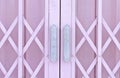 Pink metal grille sliding door with handle