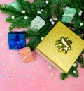 Flat lay gift box with ribbon, marshmallow, christmas fir tree and rainbow holographic stars confetti. Holiday square social media