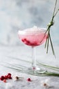 Pink mocktail close up. Beverage with rose and prosecco wine in drinkware. Exotic French Martini cocktail portion with crushed ice Royalty Free Stock Photo