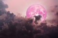 pink moon back dark magenta cloud over the sea