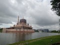 Pink mosque putrajaya lakeside cloudy view Royalty Free Stock Photo