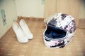 Pink motorcycle helmet and women's shoes