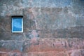 Pink multicolored weathered outdoor wall with window. Urban background. Royalty Free Stock Photo