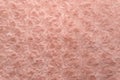 Pink natural wool with twists texture background. Cotton wool, white fleece carpet. Red fur rug with pattern Royalty Free Stock Photo