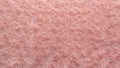 Pink natural wool with twists texture background. Cotton wool, white fleece carpet. Red fur rug with pattern Royalty Free Stock Photo