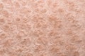 Pink natural wool with twists texture background. Cotton wool, white fleece carpet. Red fur rug with pattern Royalty Free Stock Photo