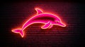 Pink Neon Dolphin Sign on Brick Wall Royalty Free Stock Photo