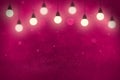 Pink cute sparkling glitter lights defocused bokeh abstract background with light bulbs and falling snow flakes fly, celebratory Royalty Free Stock Photo