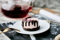 Pink no baking raspberry cake with magazine and teapot. Healthy vegan dessert. Romantic dinner with candles Royalty Free Stock Photo