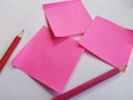 Pink note paper and red pencil Royalty Free Stock Photo