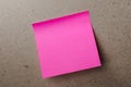 Pink note paper on wood board as a background Royalty Free Stock Photo