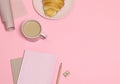 Pink note with pencil and sharpener, coffee cup, cake on pink background Royalty Free Stock Photo