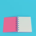 Pink notepad on bright blue background in pastel colors