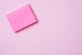 Pink Notepad paper clip and pencil on pink background with copy space. Concept school education, office and freelancing Royalty Free Stock Photo