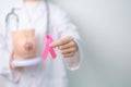 Pink October Breast Cancer Awareness month, doctor woman with pink Ribbon and Breast Anatomy model. National cancer survivors Royalty Free Stock Photo